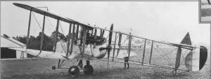 an old photo of a small plane on the ground