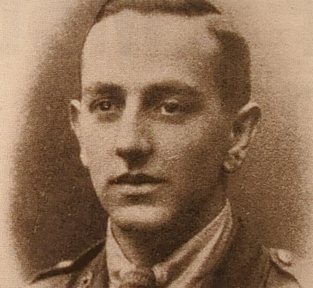 a black and white photo of a man in uniform