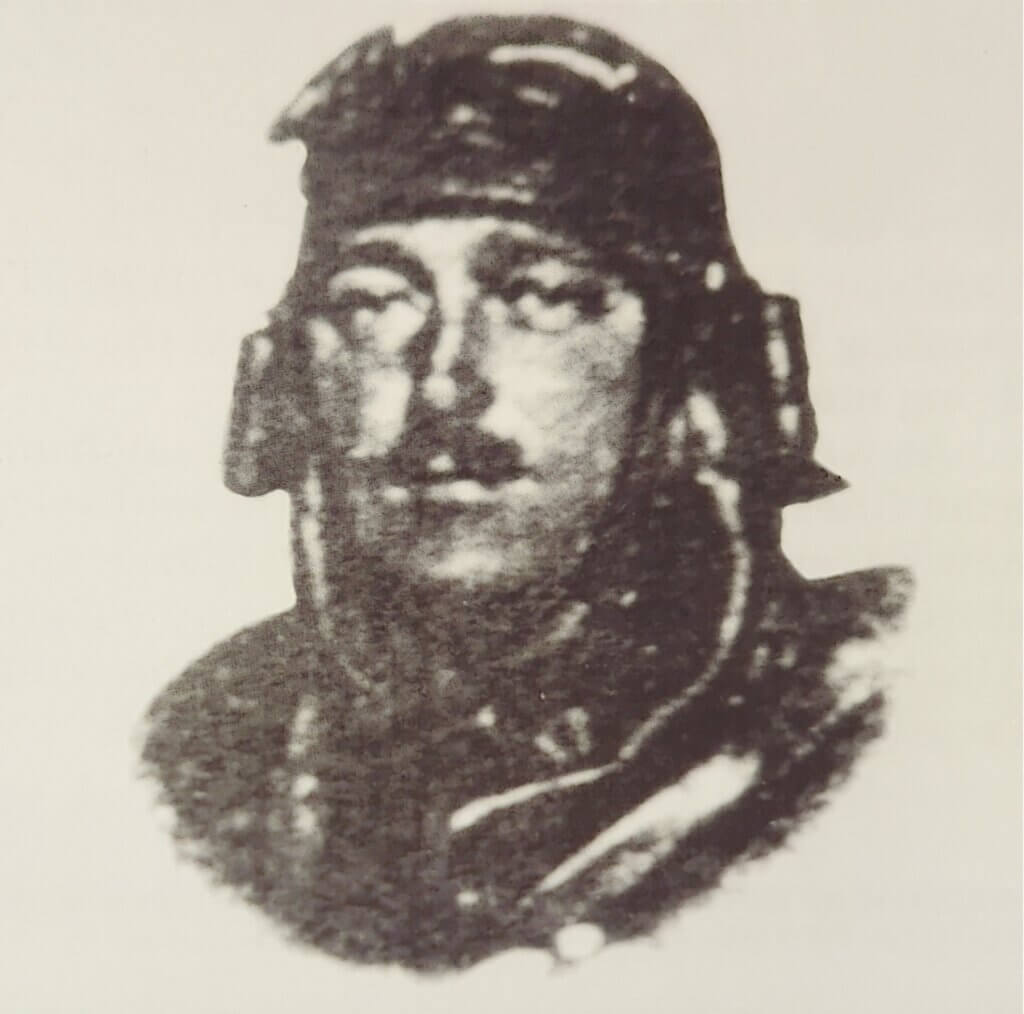 a black and white photo of a man in uniform