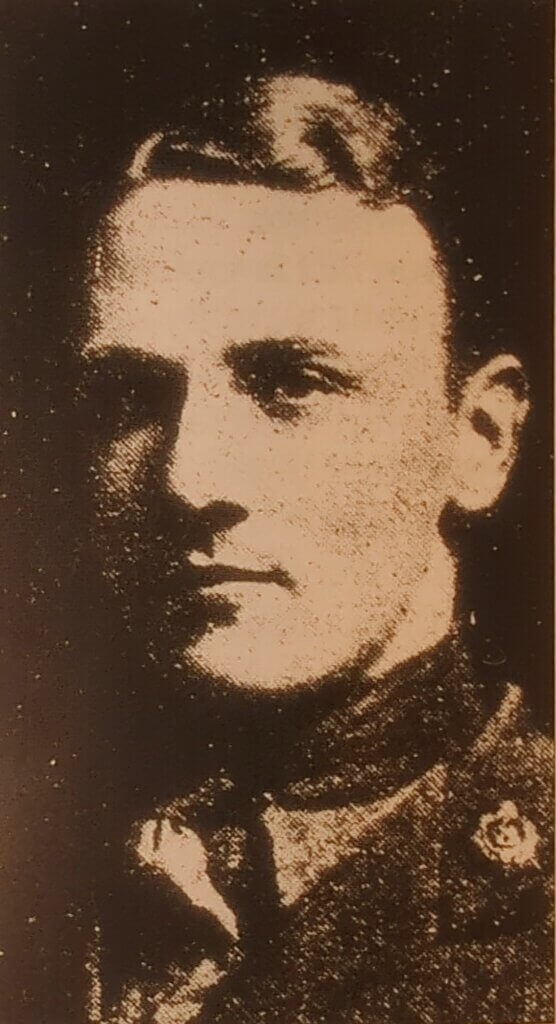 a black and white photo of a man in uniform