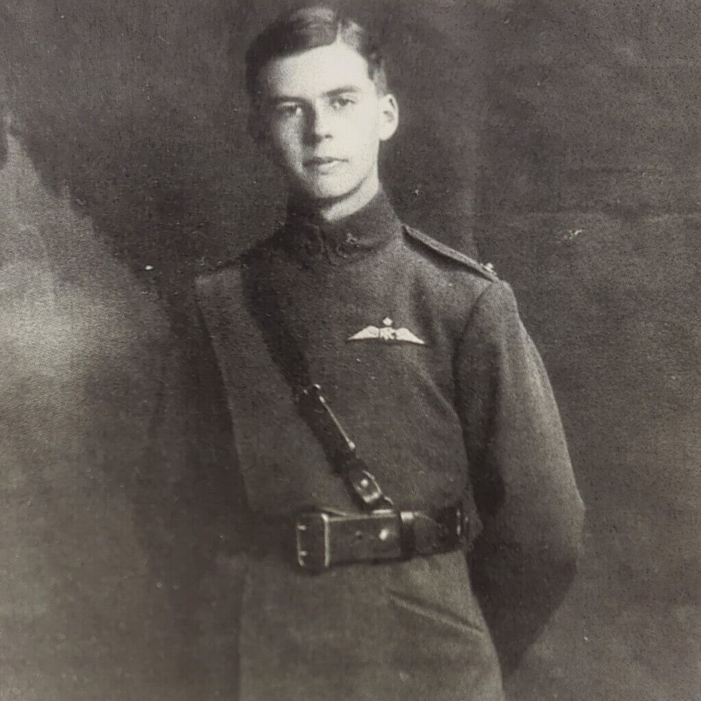 a black and white photo of a man in uniform