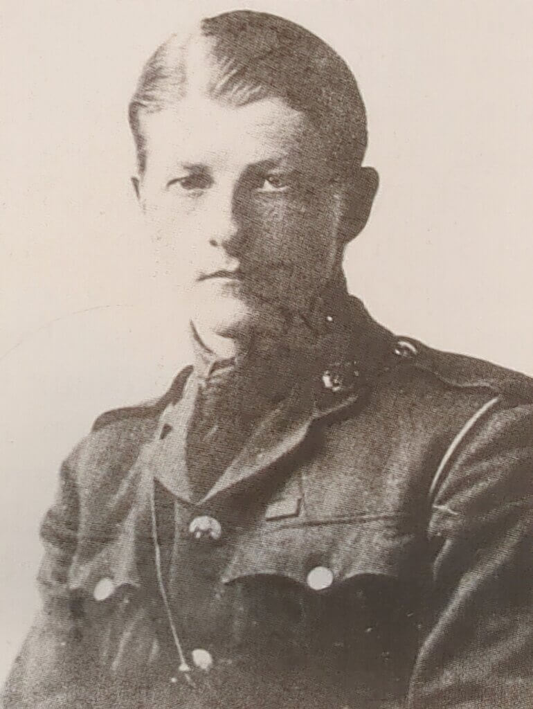 a black and white photo of a man in uniform