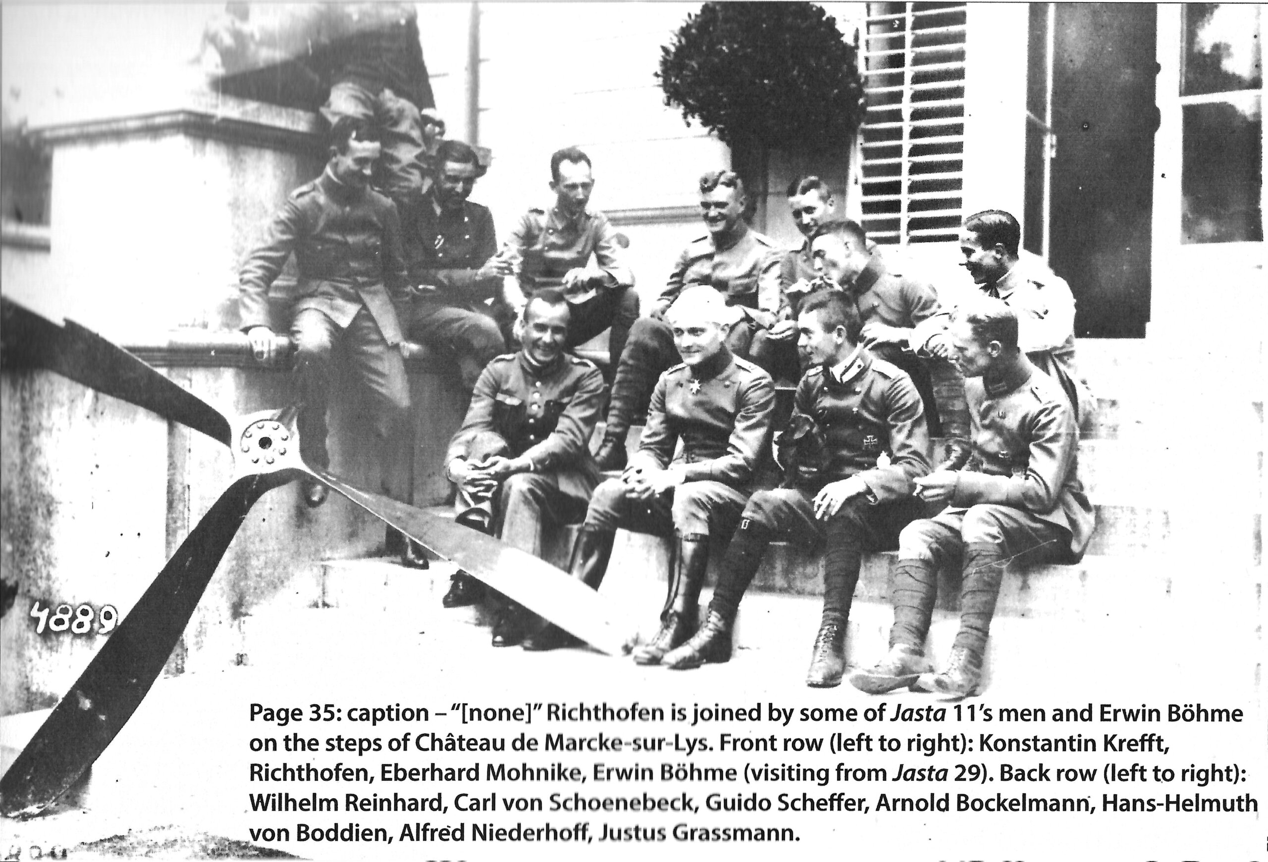 a black and white photo of a group of men