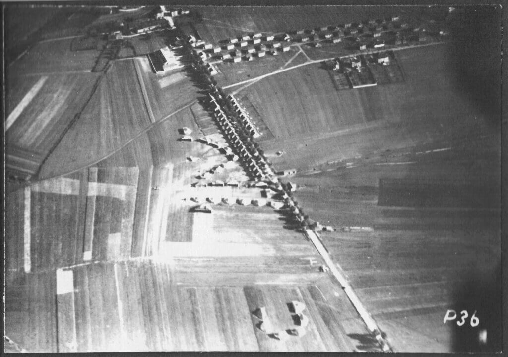 a black and white photo of an aerial view of a farm