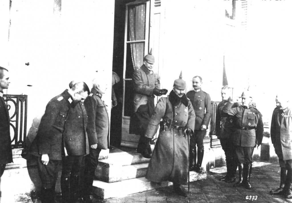 a group of men standing outside of a building