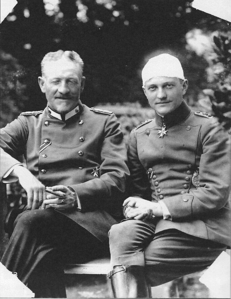 a black and white photo of two men in uniforms